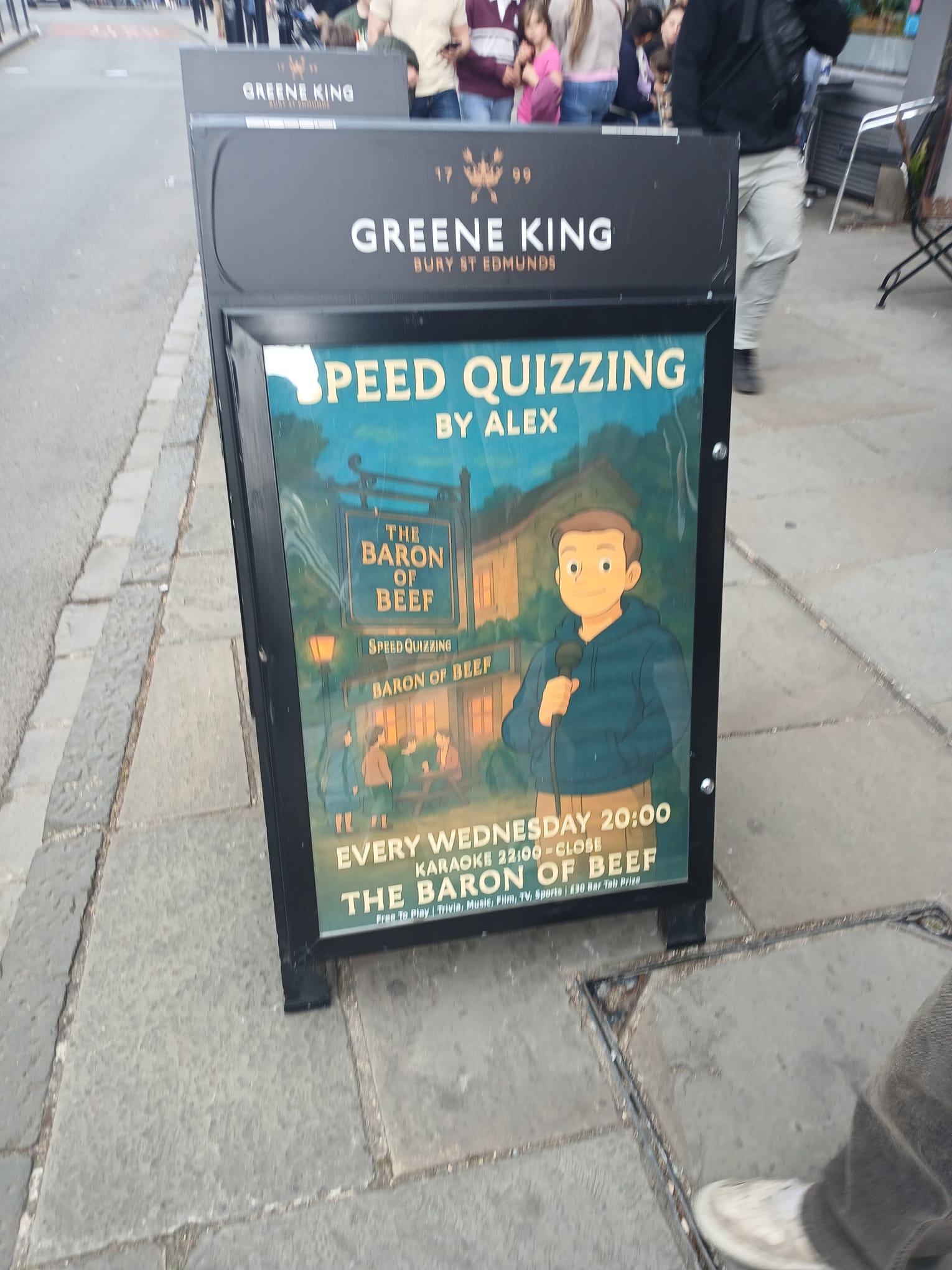 A picture of a restaurant stand. On it is an advertisement for "Speed Quizzing by Alex". The advertisement is in a cartoon style, resembling that of Studio Ghibli. For an obviously AI-generated image, the text on it is scarily seamless.