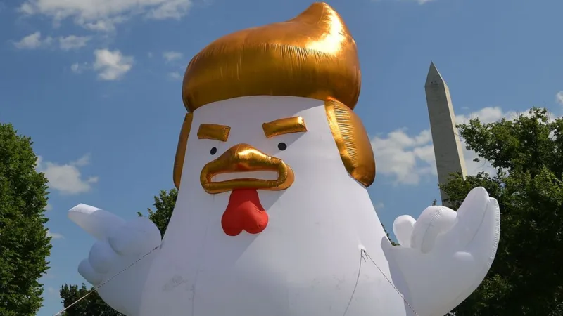 A huge white inflatable chicken that looks like Trump, with a wattle reminiscent of a scrotum, frowning and gesturing angrily. In the background one can see the Washington Monument.