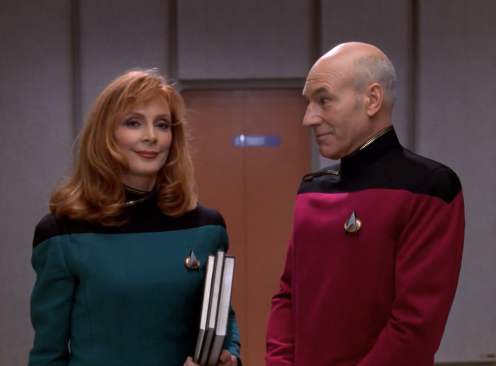 screenshot of Sub Rosa at the moment when Picard says "exceptionally vigorous libidos"; Picard's eyebrows are raised and Dr. Crusher is smiling