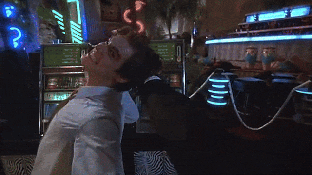 Clip from "The Mask" in which Stanley (Jim Carrey) punches out Dorian (Peter Greene, who played Zed in "Pulp Fiction" as pictured in the parent comment)