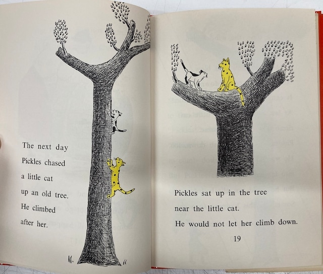 Pickles chasing a kitten up a tree and holding it hostage