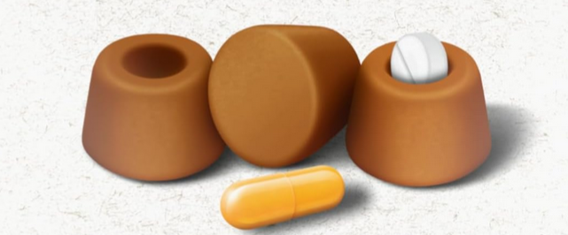 Graphic of 3 pet treats, one which has a pill inside and another pill in front of the treats