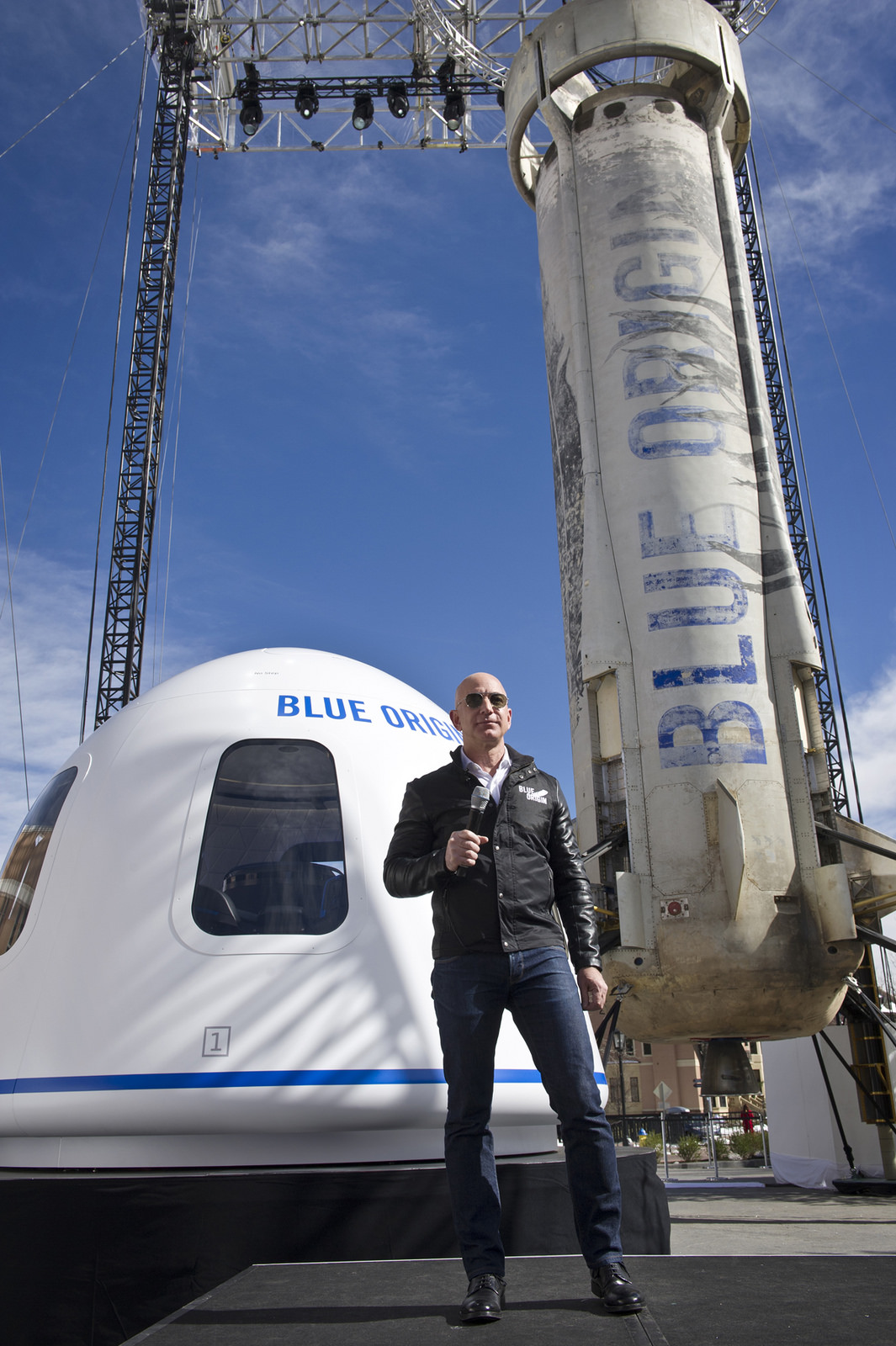 Amazon's Jeff Bezos standing in front of his rocket ship