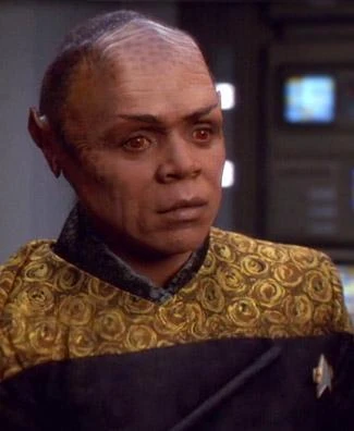 Tuvix, a Talaxian-Vulcan hybrid that was created when the transporter patterns of Neelix and Tuvok were mixed, along with an exotic flower.