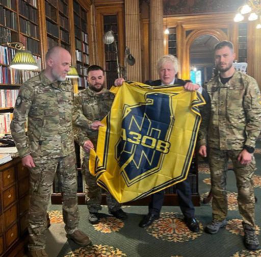 Boris Johnson posing with members of Azov
